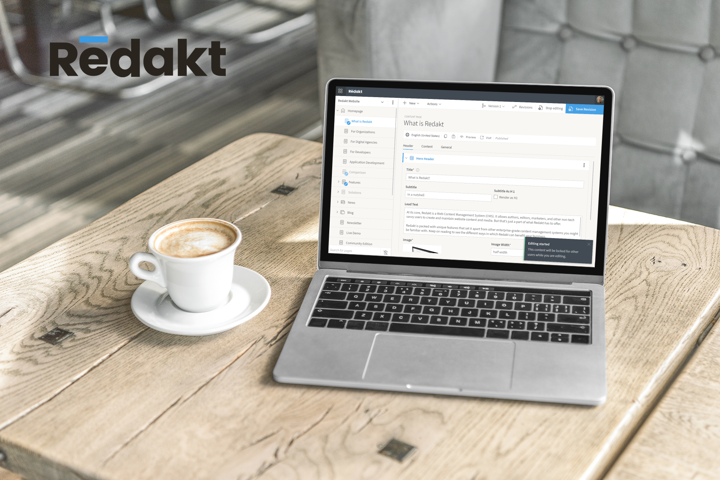 Laptop on a wooden desk with a screenshot of Redakt version 1.3 content editing experience